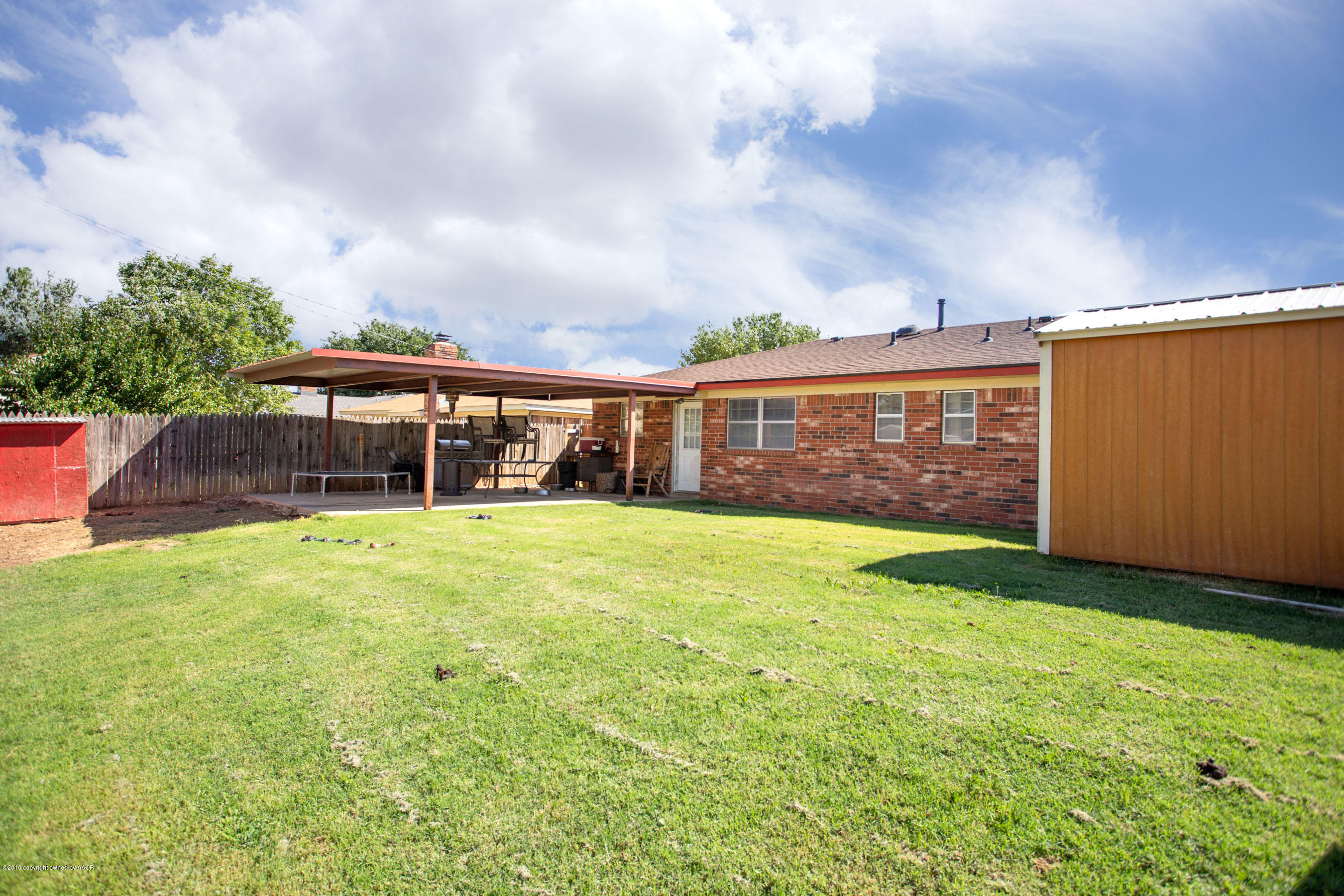5328 Capulin Lane Amarillo, TX 79110 - Photo 16 of 17 a front view of a house with garden