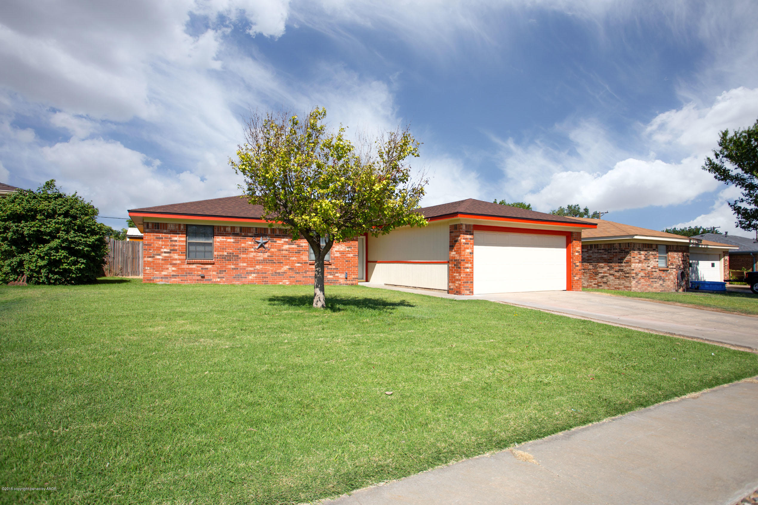 5328 Capulin Lane Amarillo, TX 79110 - Photo 2 of 17 a plant in front of a house next to a yard