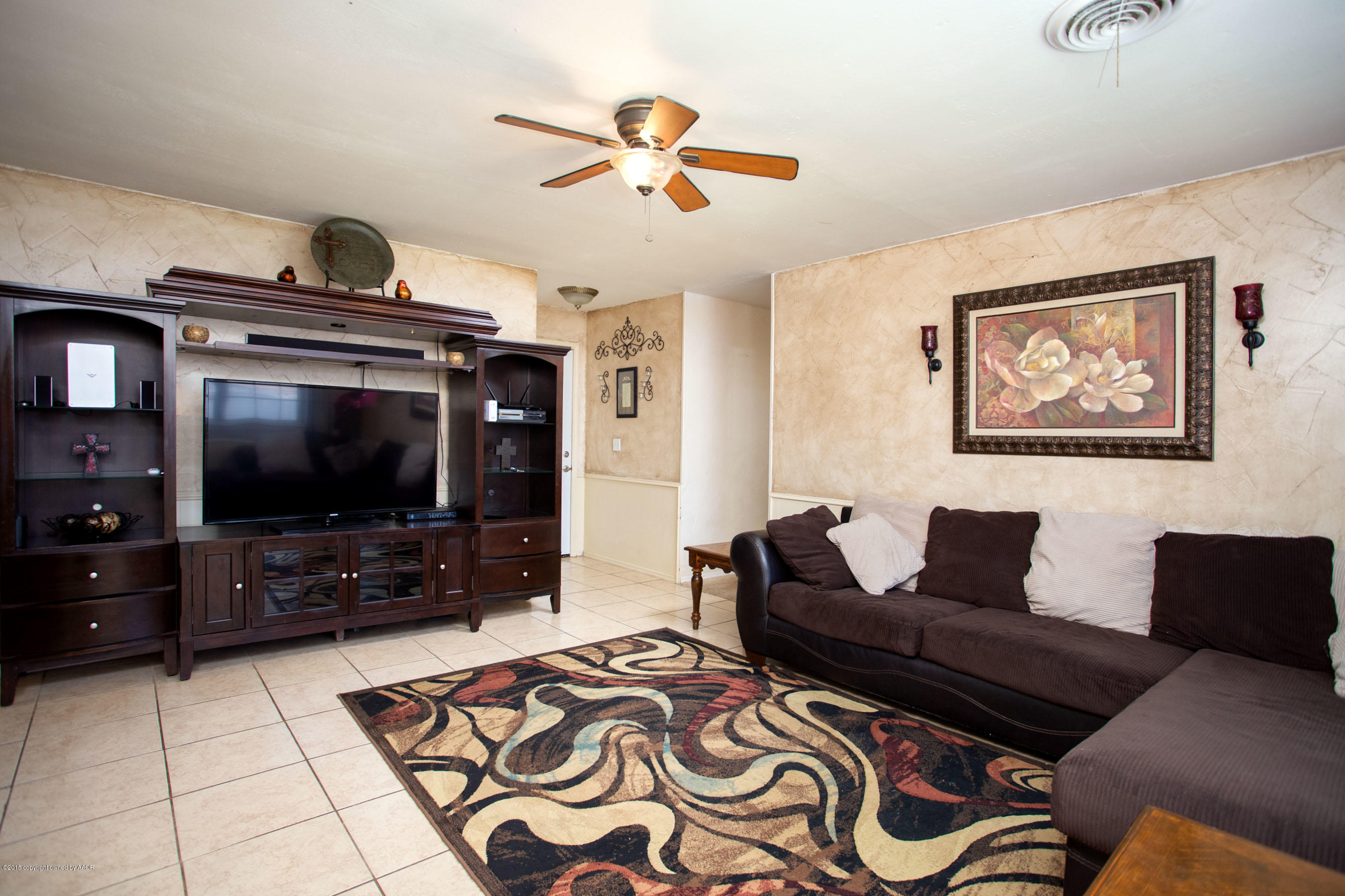 5328 Capulin Lane Amarillo, TX 79110 - Photo 3 of 17 a living room with furniture and a flat screen tv