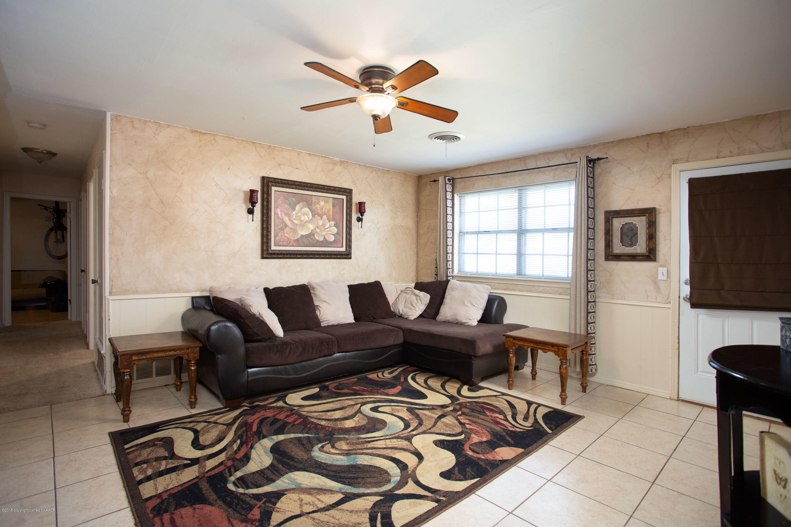 5328 Capulin Lane Amarillo, TX 79110 - Photo 5 of 17 a living room with furniture and a flat screen tv