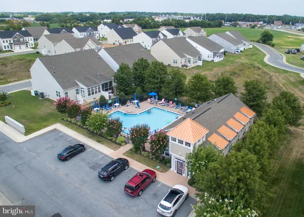 an aerial view of a house with outdoor space