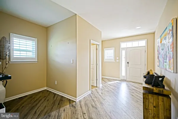 a kitchen with granite countertop a sink and cabinets