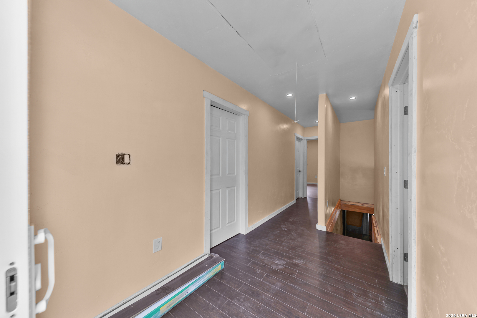 122 Brink Center Point, TX 78010 - Photo 20 of 40 a view of a hallway with wooden floor and a bathroom