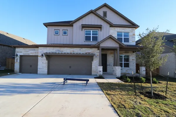 a front view of a house with yard