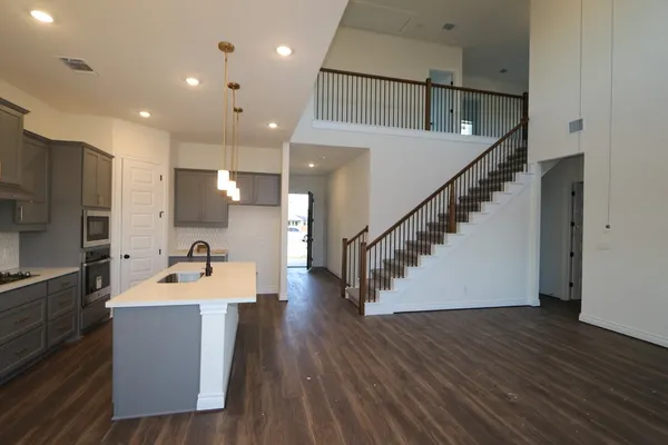 a room with wooden floor and furniture