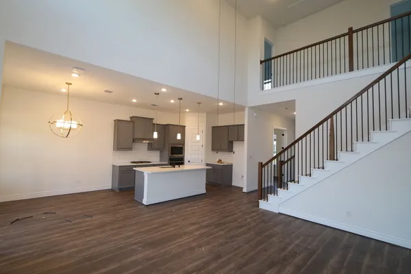 a view of kitchen with sink and microwave