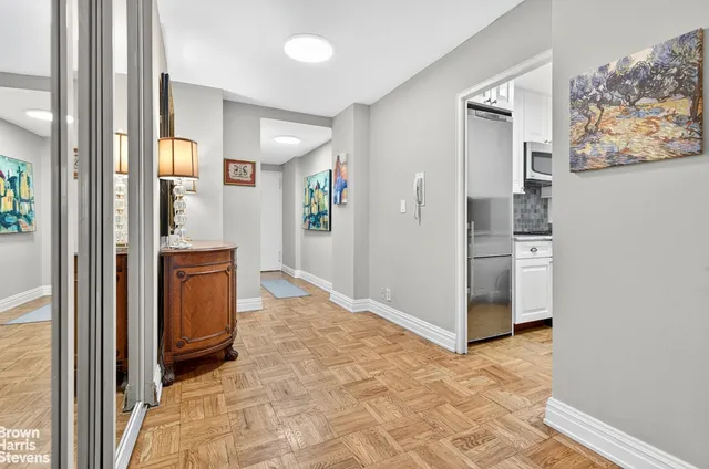 a kitchen with granite countertop a sink stove and cabinets