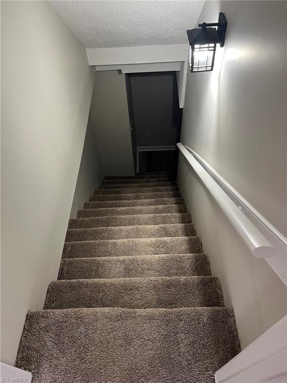 201 Jim Barr Road King, NC 27021 - Photo 27 of 33 Basement stairs