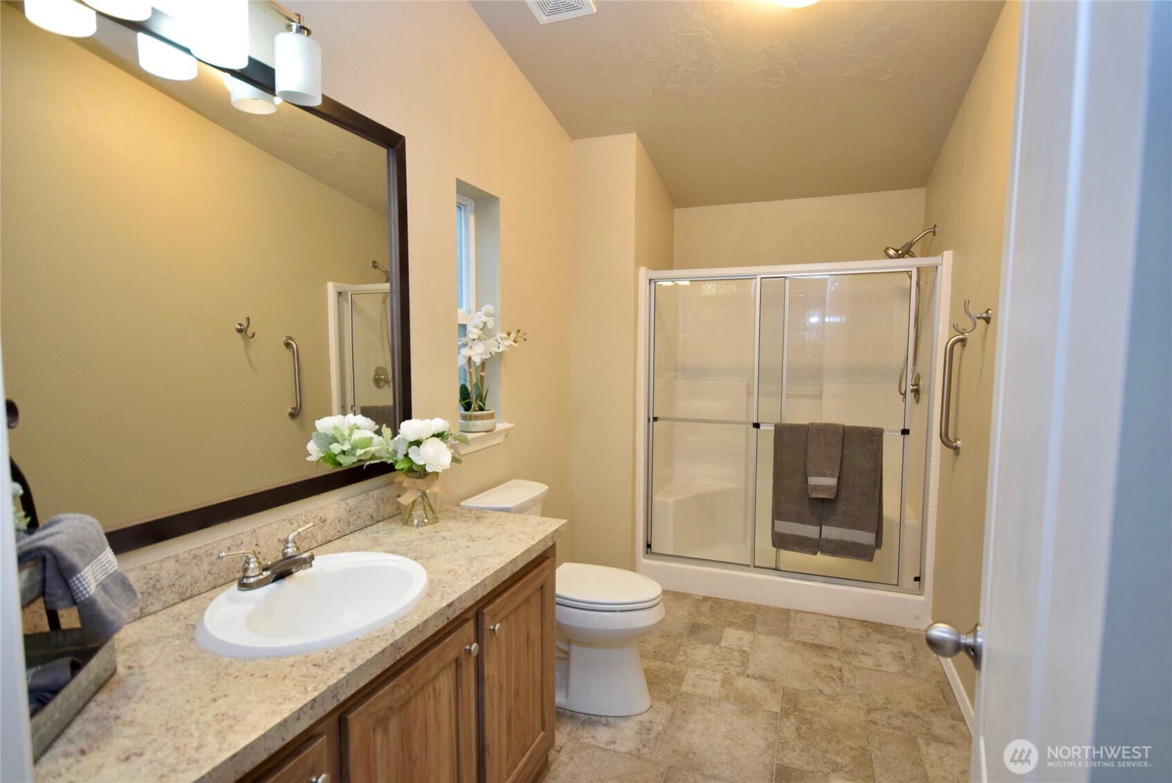 375 Dungeness Meadows Sequim, WA 98382 - Photo 17 of 27 a bathroom with a granite countertop sink toilet and shower