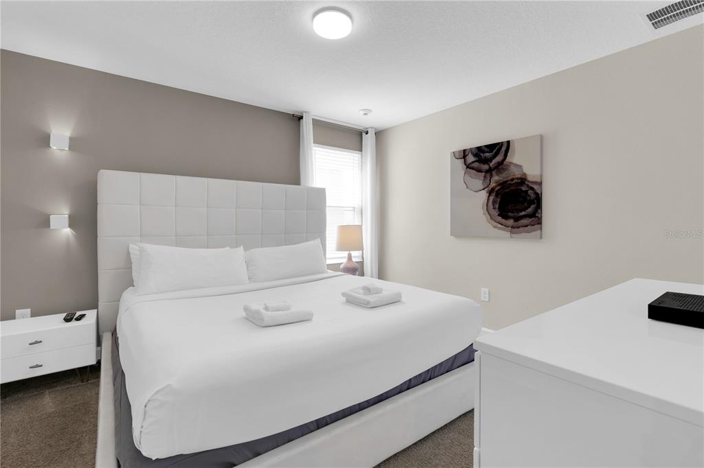 4530 Narrative Lane Kissimmee, FL 34746 - Photo 43 of 98 a bedroom with a bed and a cabinets