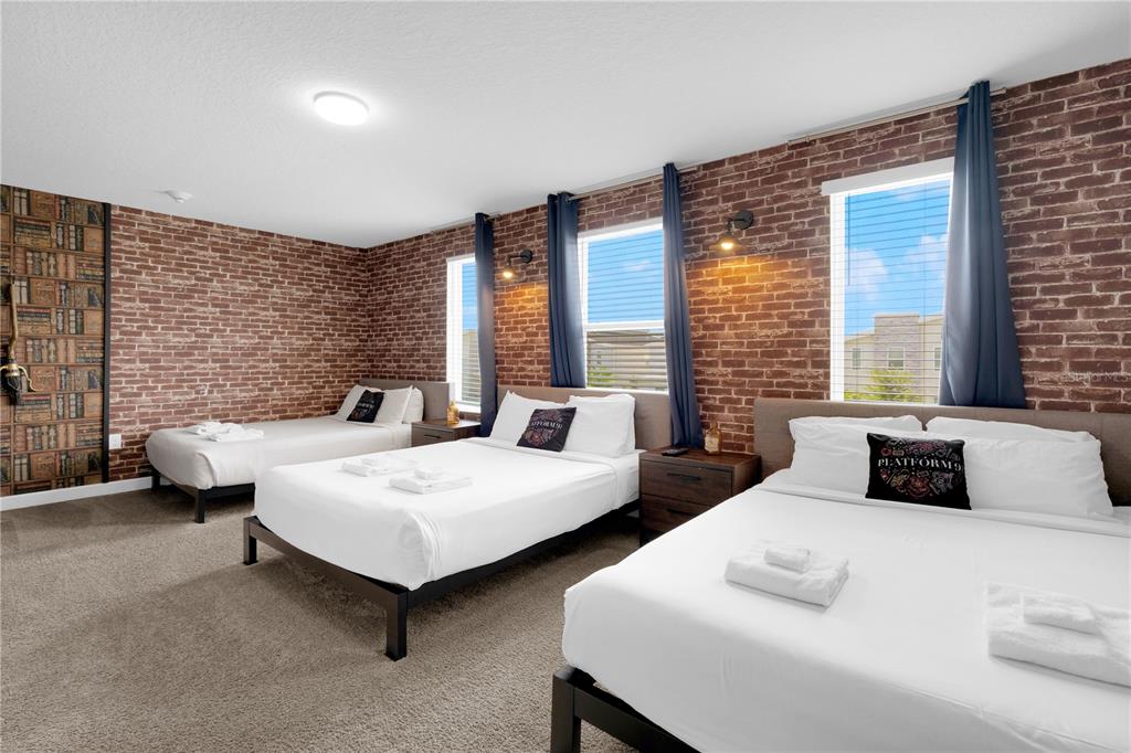 4530 Narrative Lane Kissimmee, FL 34746 - Photo 45 of 98 a bedroom with two beds and large windows