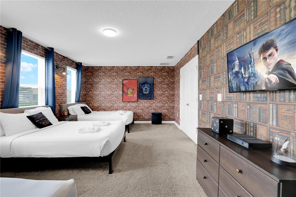 4530 Narrative Lane Kissimmee, FL 34746 - Photo 47 of 98 a living room with furniture and a flat screen tv