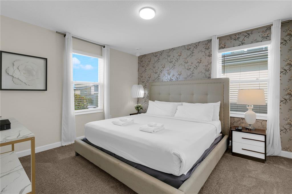 4530 Narrative Lane Kissimmee, FL 34746 - Photo 49 of 98 a bedroom with a bed and a window