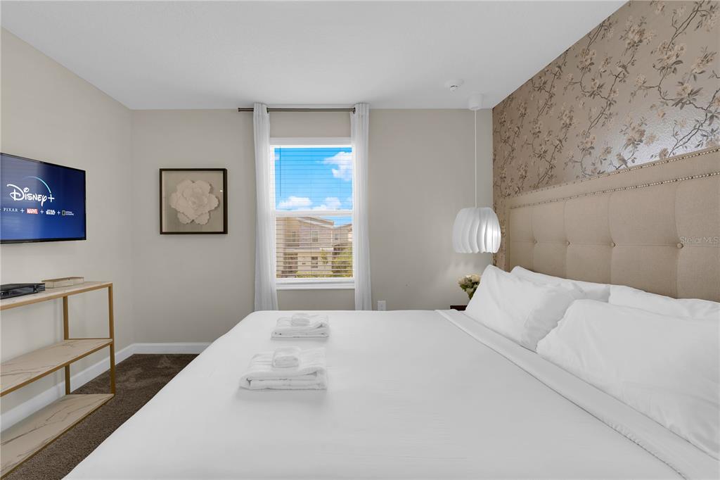 4530 Narrative Lane Kissimmee, FL 34746 - Photo 51 of 98 a bedroom with a bed and a window