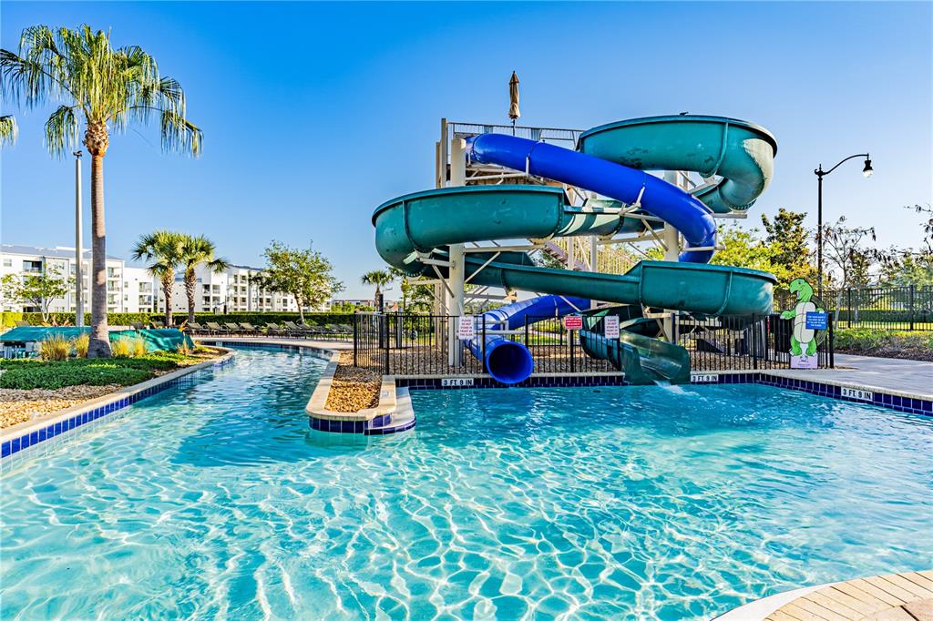 4530 Narrative Lane Kissimmee, FL 34746 - Photo 72 of 98 an outdoor space with furniture and umbrella