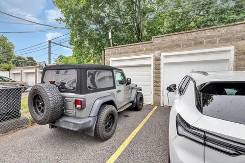 a view of a two chairs in the back yard