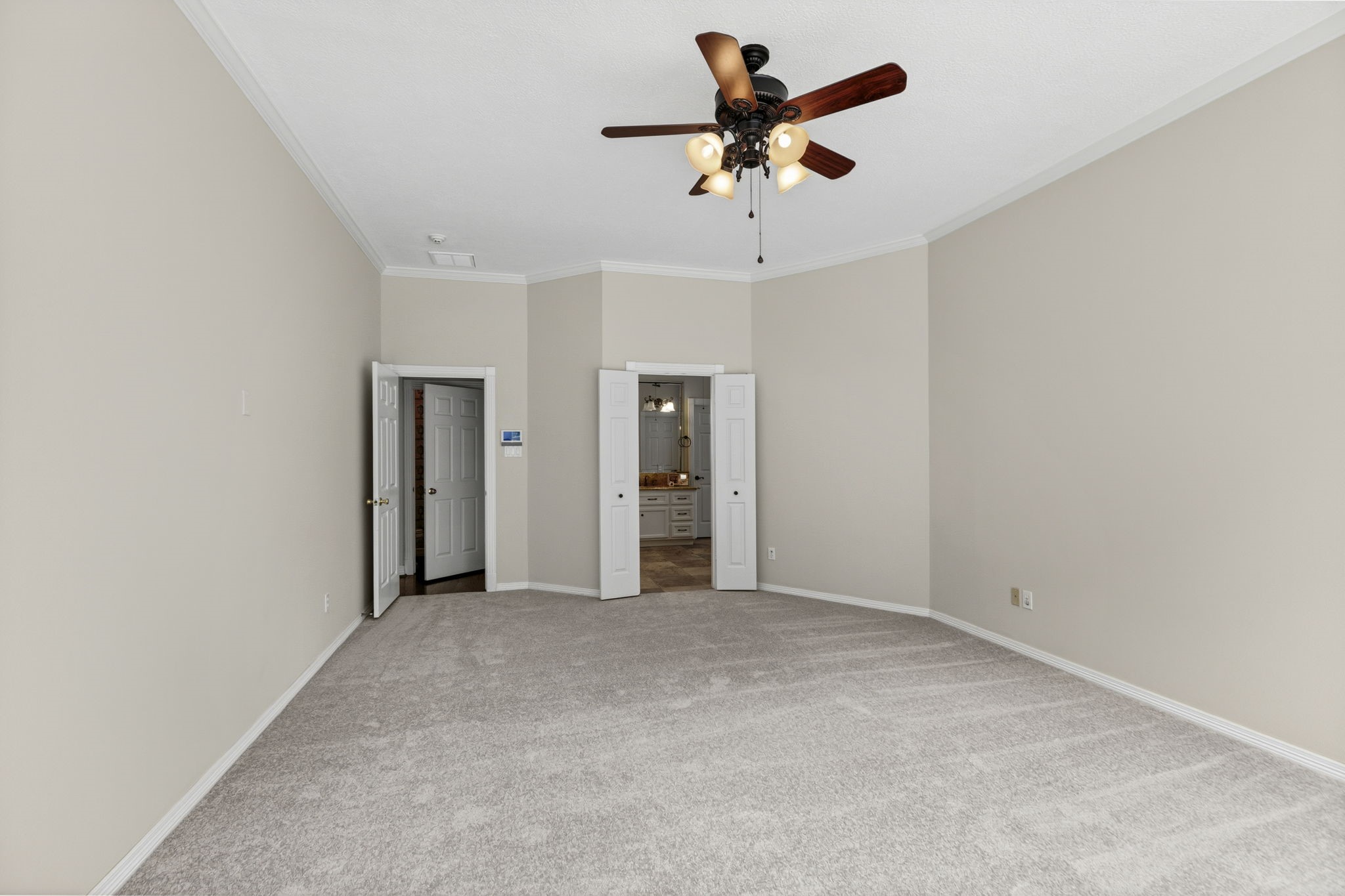 18310 Pamela Way Spring, TX 77379 - Photo 21 of 42 Primary suite featuring brand-new carpet and fresh interior paint, leading directly into the primary bathroom.