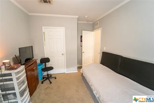 a bedroom with furniture and a bed
