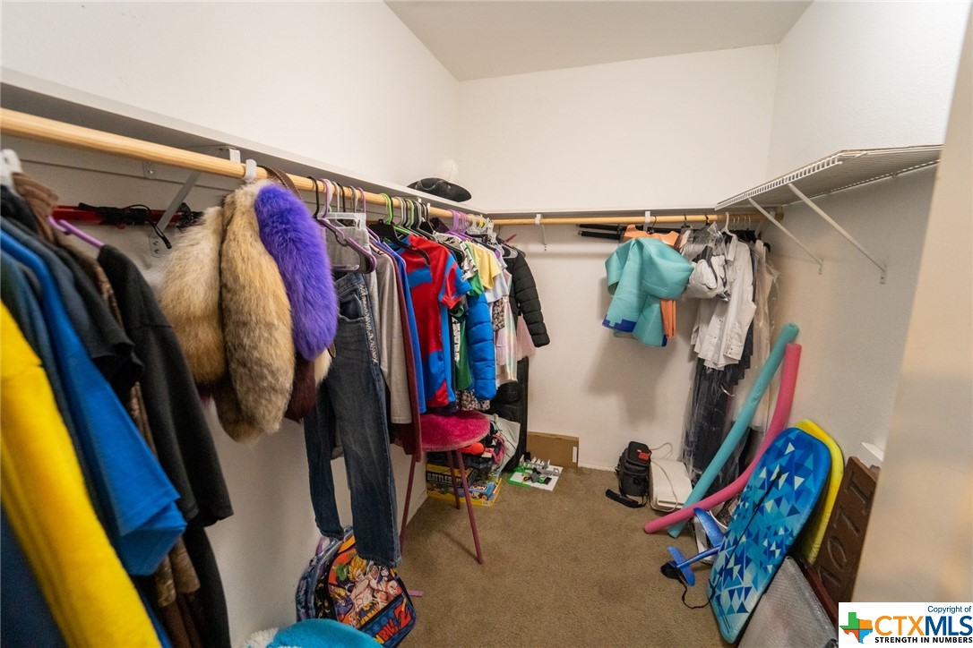 443 Joe Pokluda Road Nordheim, TX 78141 - Photo 26 of 26 a view of walk in closet with clothes and shoes