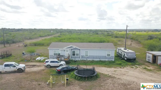 a view of a patio in backyard