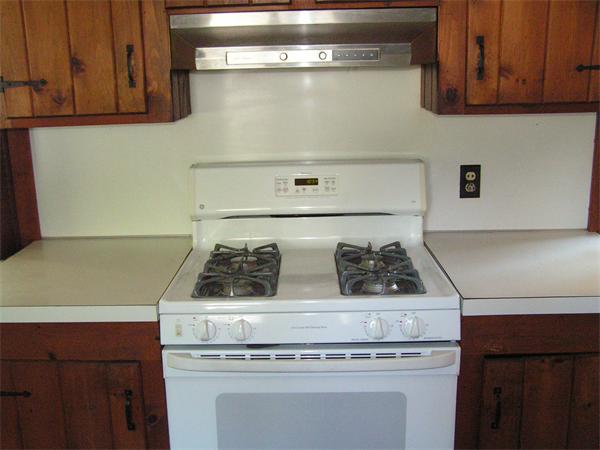 118 Little River Road Westfield, MA 01085 - Photo 7 of 18 a stove top oven sitting inside of a kitchen