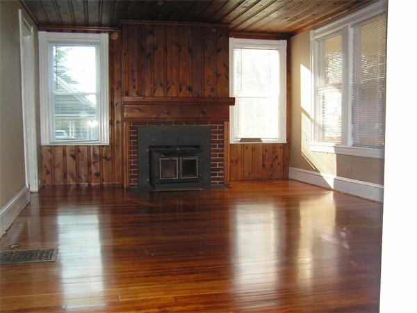 118 Little River Road Westfield, MA 01085 - Photo 9 of 18 a living room with wooden floors and a fireplace