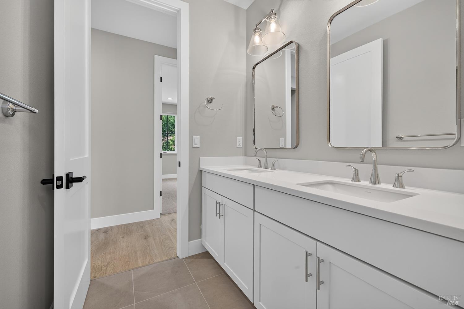 1907 Carlile Place Santa Rosa, CA 95403 - Photo 39 of 55 This bathroom also has tiled floors (like all bathrooms and the laundry room), and dual sink vanity with quartz countertop.