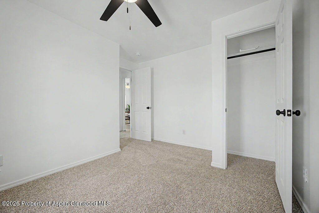 54 South Ranney Street Craig, CO 81625 - Photo 11 of 32 wooden floor in an empty room