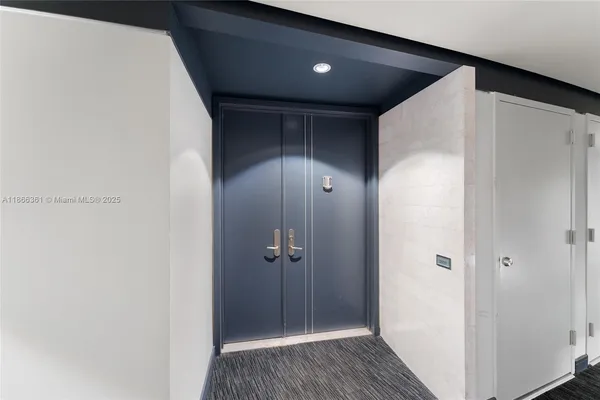 a bathroom with a shower and a sink