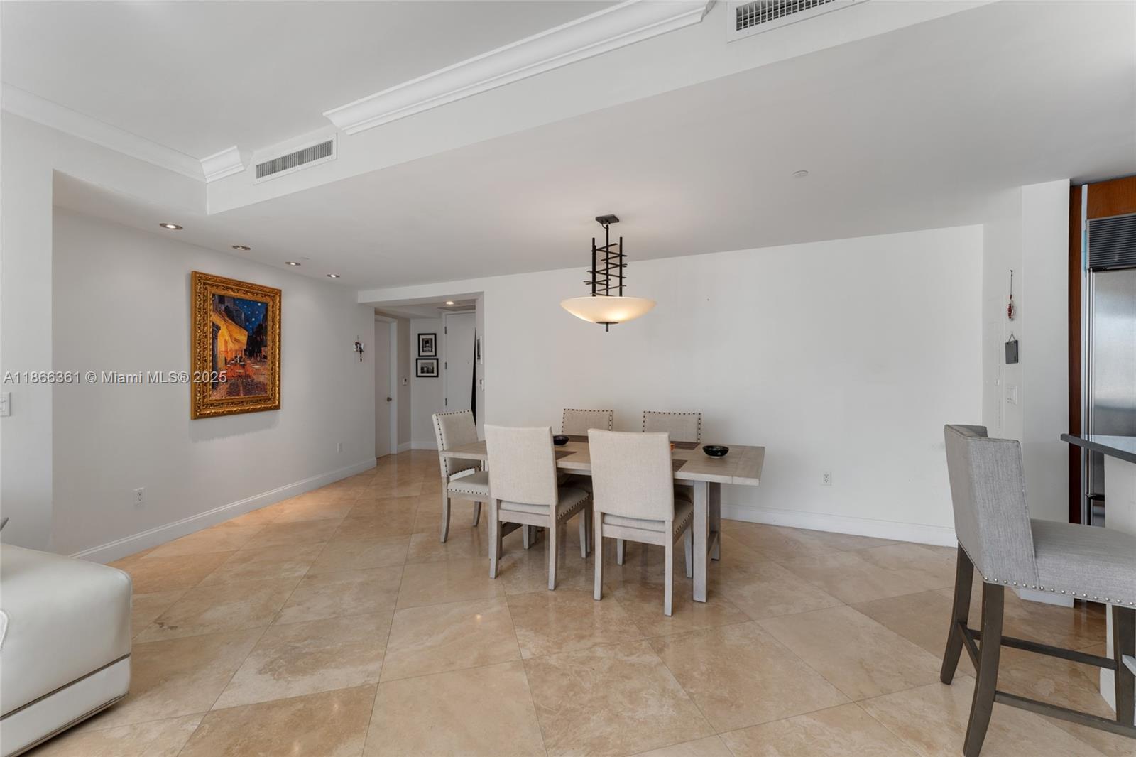 901 Brickell Key Boulevard, Unit 2801 Miami, FL 33131 - Photo 13 of 22 a dining room with furniture and window