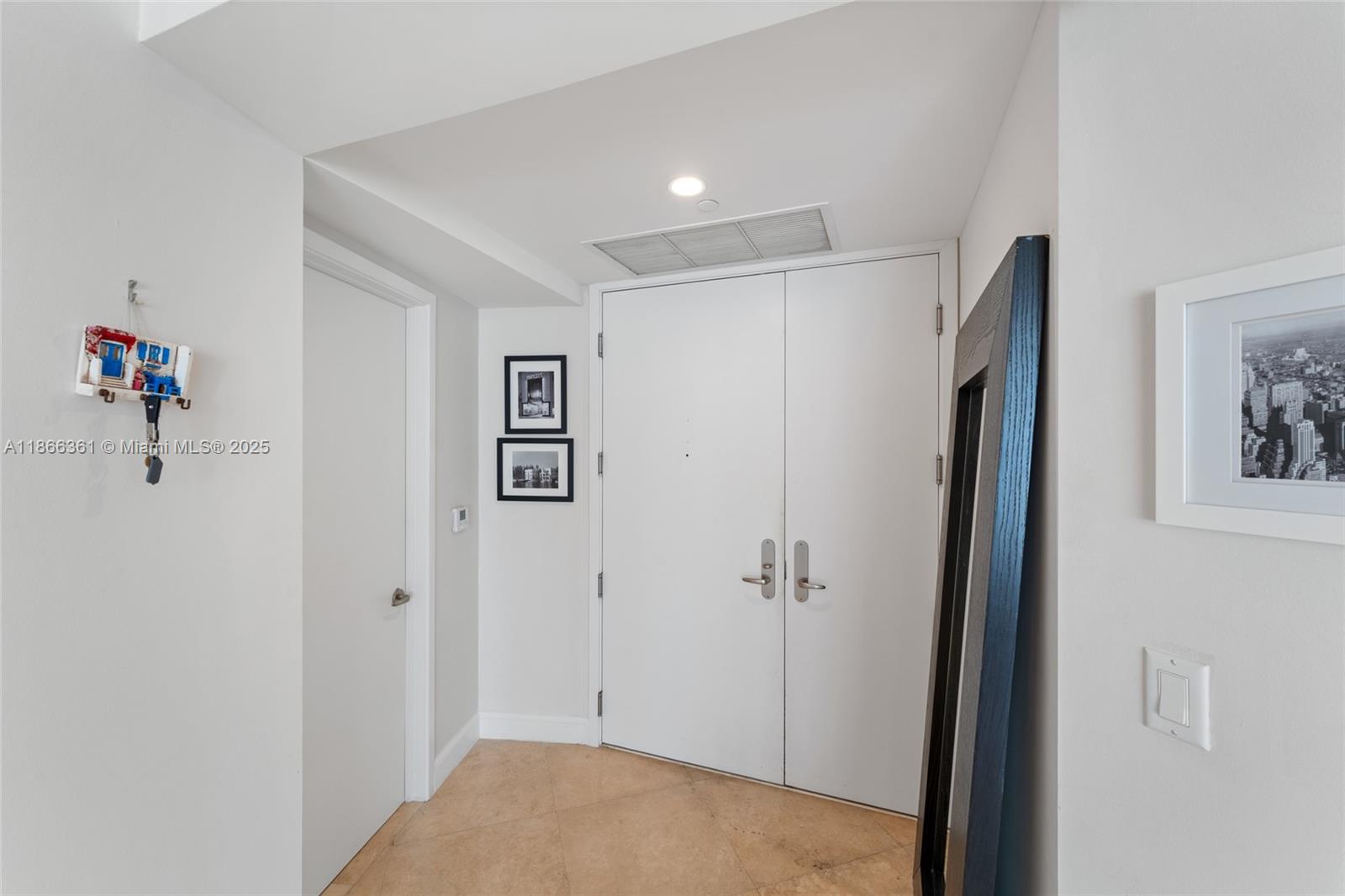901 Brickell Key Boulevard, Unit 2801 Miami, FL 33131 - Photo 2 of 22 a view of a hallway with closet