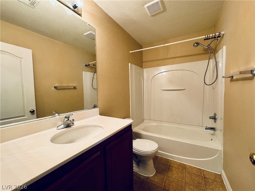 8617 Palomino Ranch Street Las Vegas, NV 89131 - Photo 12 of 27 A well-appointed bathroom offers a practical and inviting space for daily routines.
