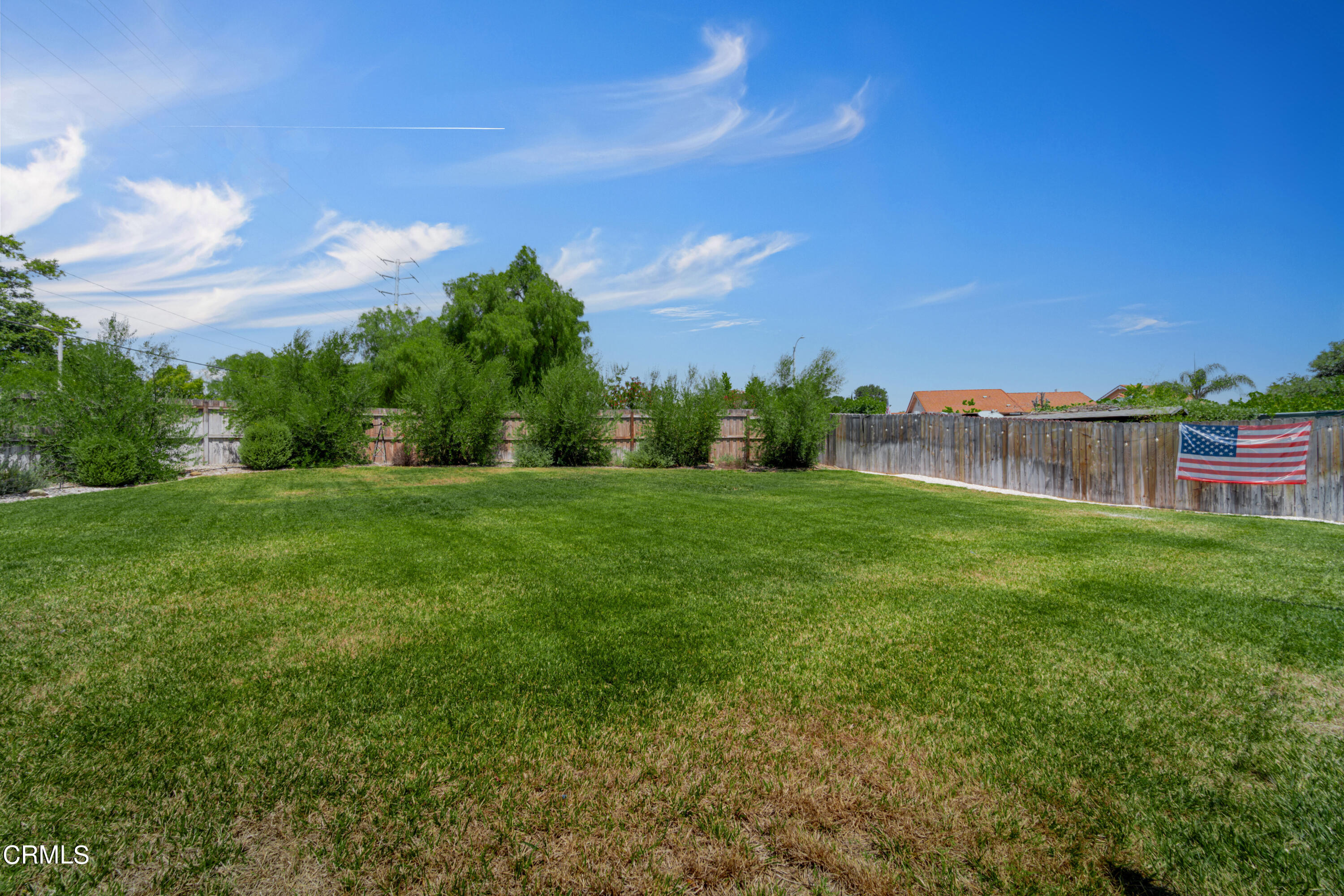 13211 Laurelhurst Road Moorpark, CA 93021 - Photo 36 of 52 a view of a garden with a building in the background