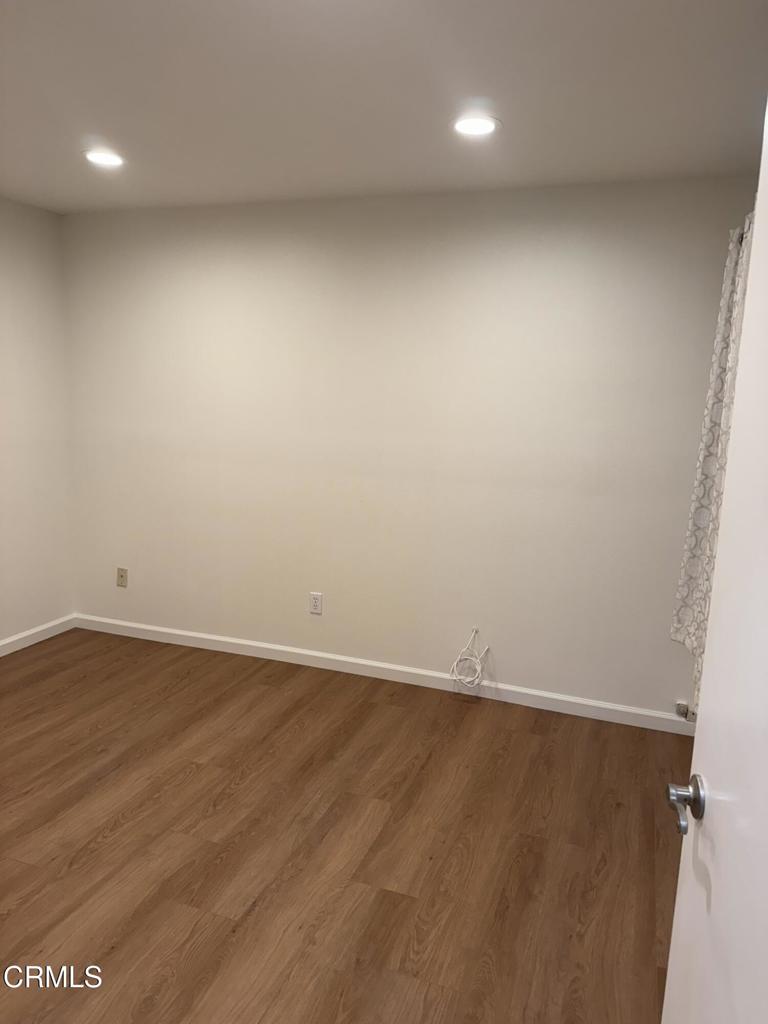 20178 Village 20 Camarillo, CA 93012 - Photo 12 of 19 an empty room with wooden floor and windows