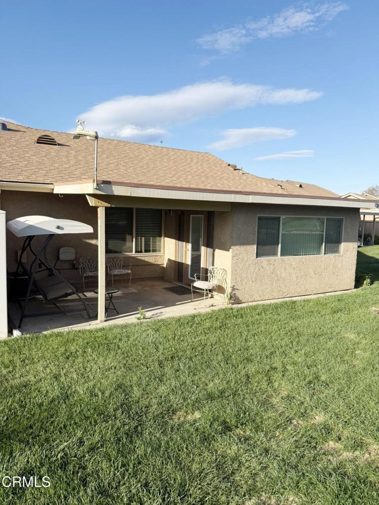 20178 Village 20 Camarillo, CA 93012 - Photo 16 of 19 a backyard of a house with table and chairs