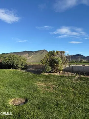 a view of an ocean and yard