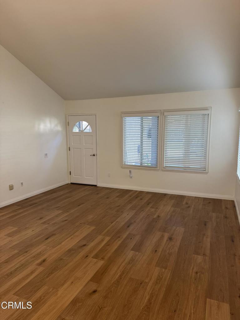 20178 Village 20 Camarillo, CA 93012 - Photo 3 of 19 an empty room with wooden floor and windows