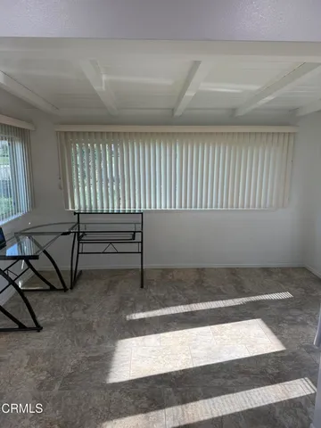 a view of an empty room and window