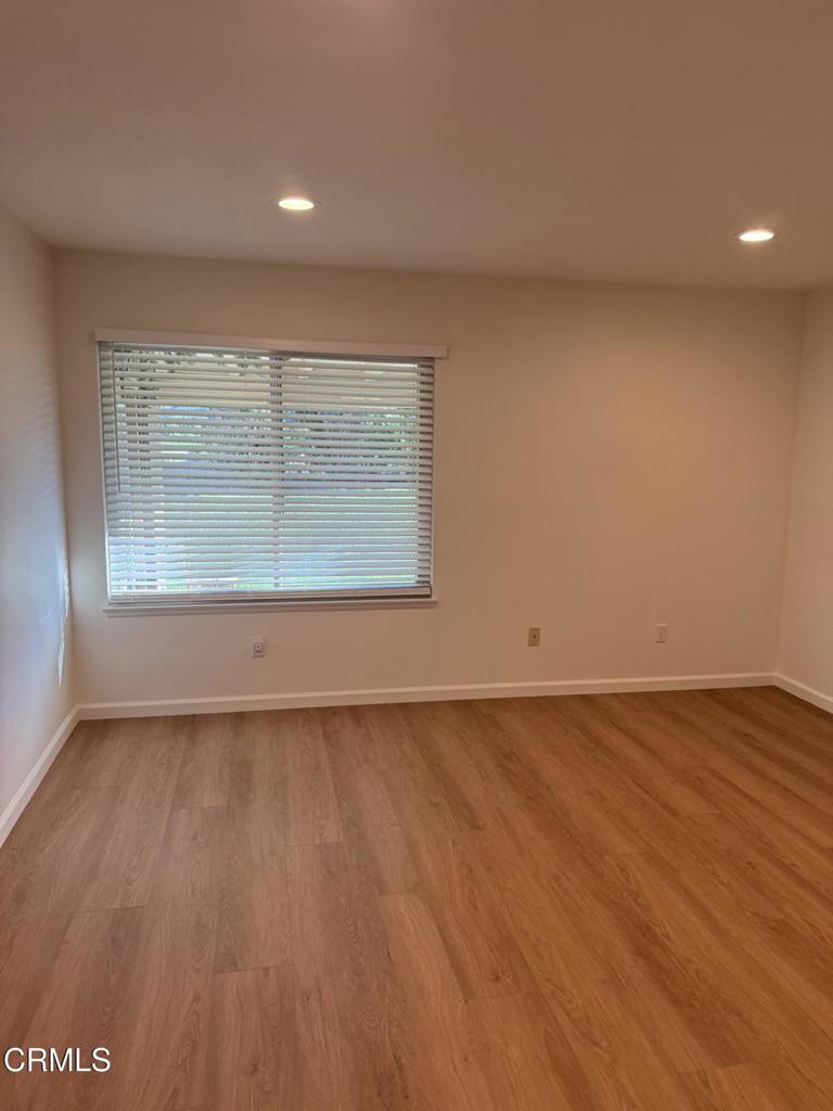 20178 Village 20 Camarillo, CA 93012 - Photo 10 of 19 an empty room with wooden floor and windows