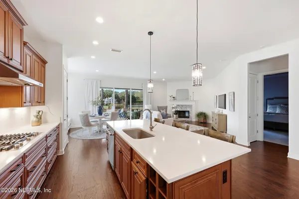 a living room with furniture and kitchen view