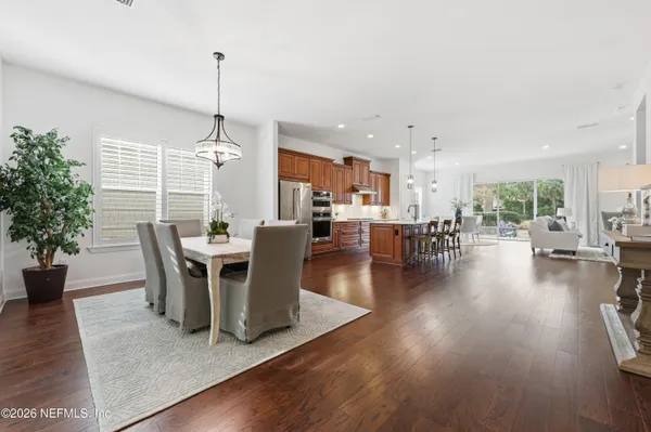 a living room with lots of furniture and a large window