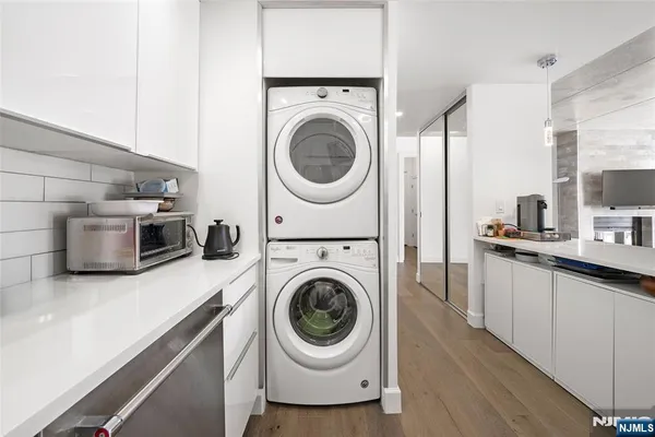 a view of a kitchen with washer and dryer