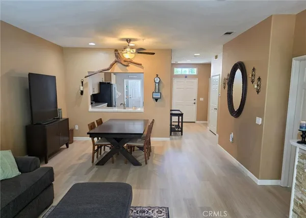 a view of a livingroom with furniture and a flat screen tv