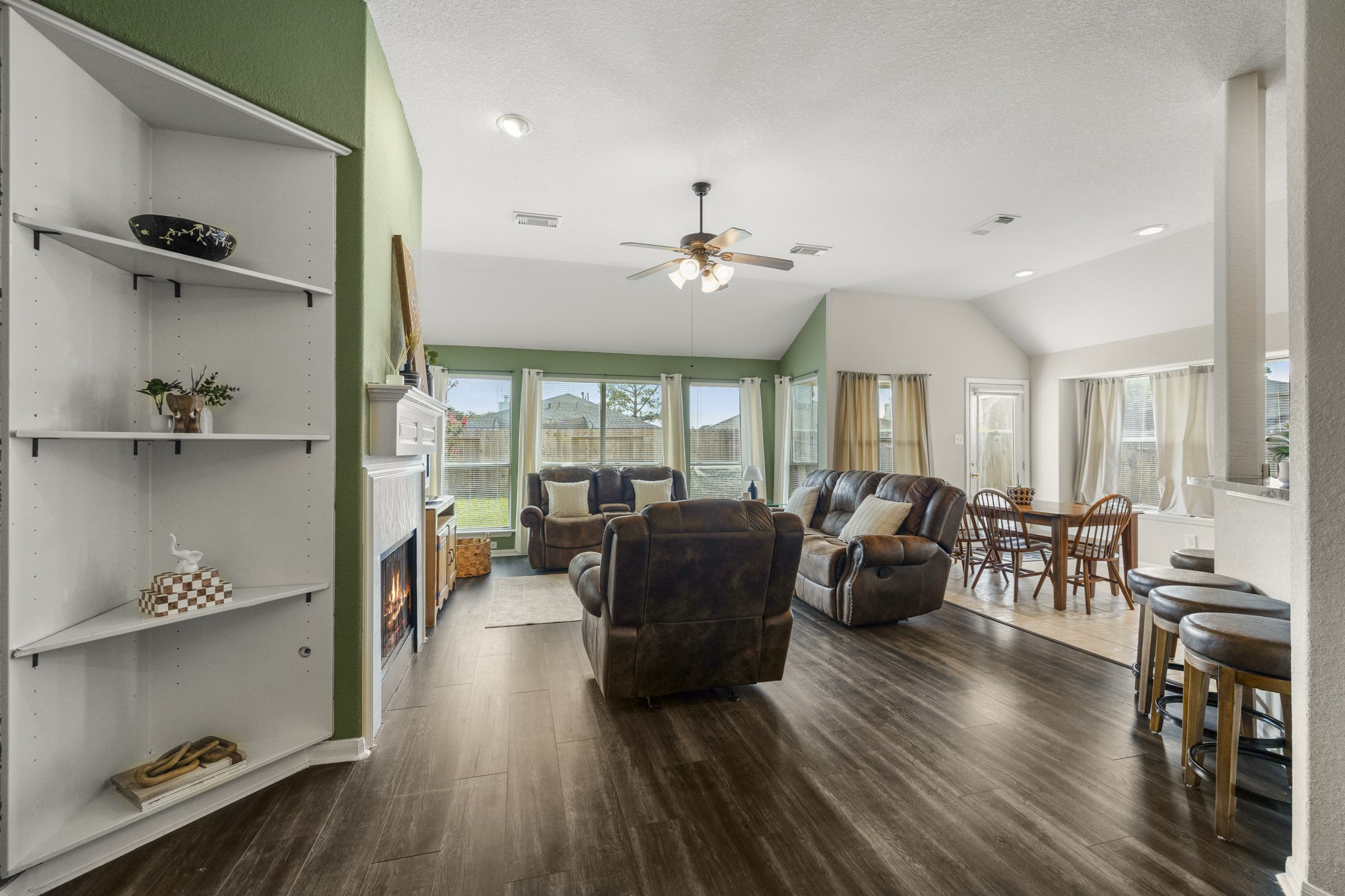 3422 Falcon Trail Court Spring, TX 77373 - Photo 7 of 35 a living room with furniture a wooden floor and a large window