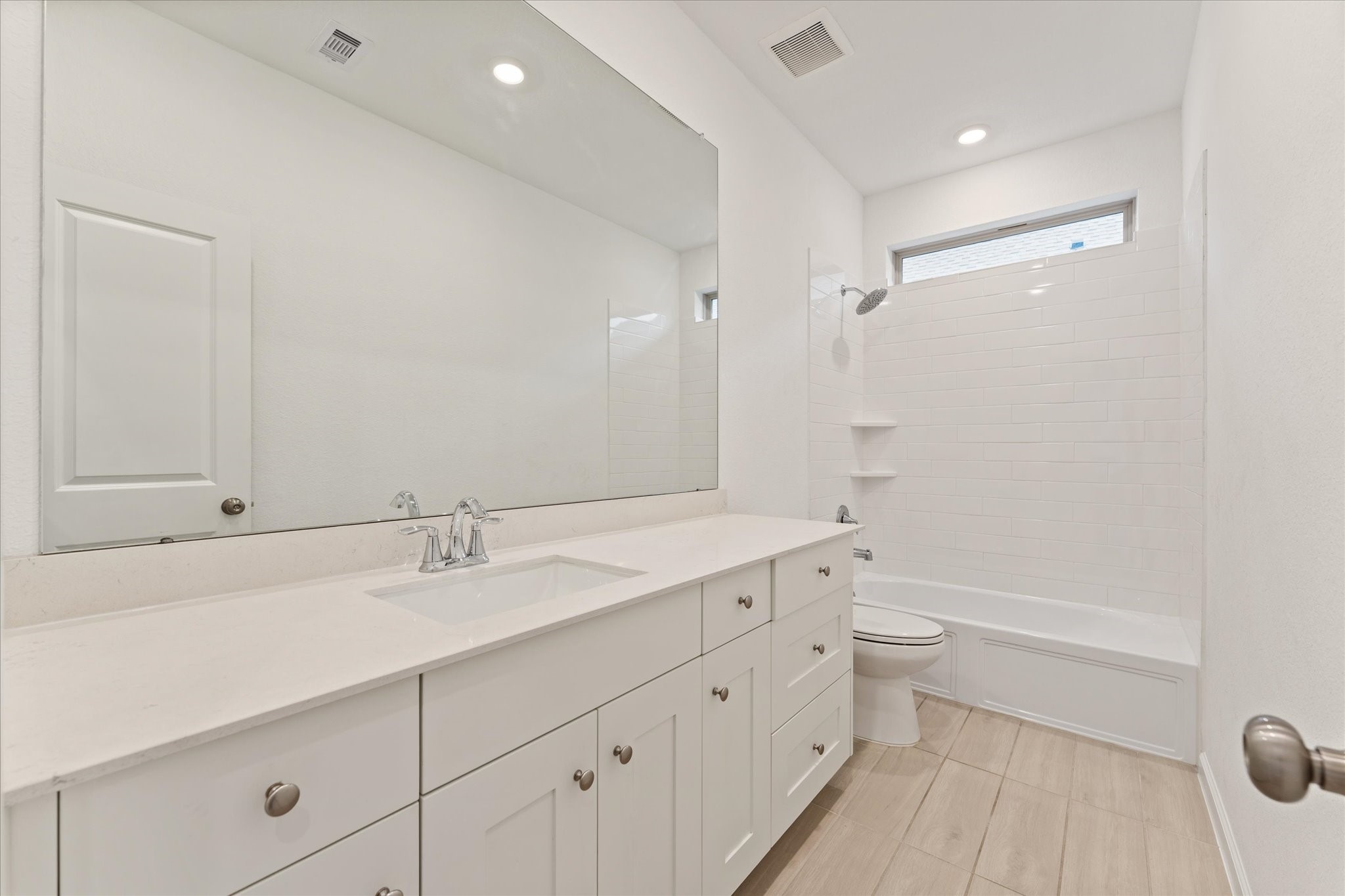 15520 Sunset Maple Court Conroe, TX 77302 - Photo 22 of 46 a bathroom with a double vanity sink toilet mirror and shower