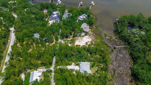 an aerial view of a houses with yard