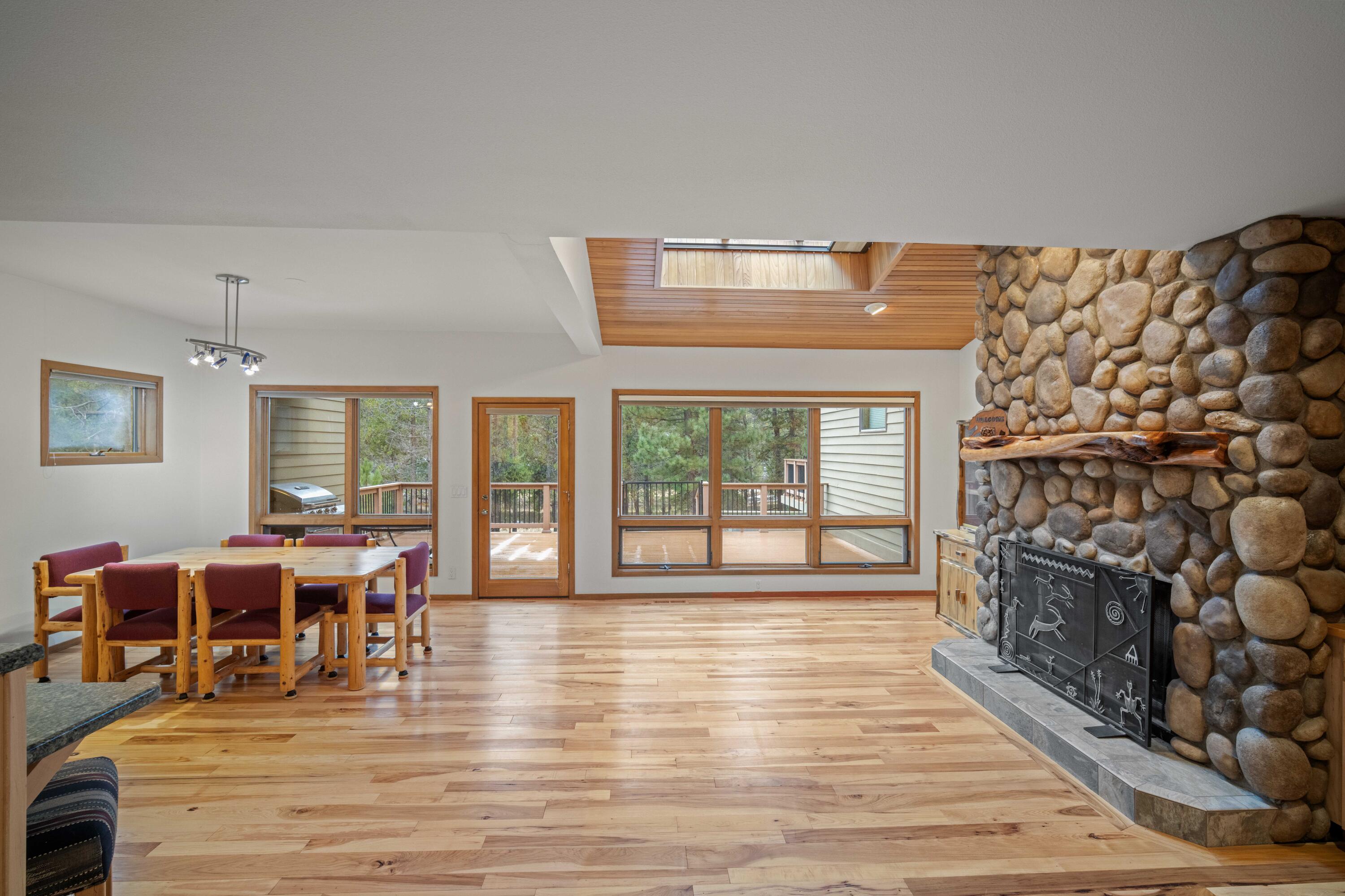 17674 Bittern Lane, Unit 7 Sunriver, OR 97707 - Photo 5 of 43 Spacious great room with vaulted ceilings, skylights, and river views. Access to deck with private access to the Deschutes River.