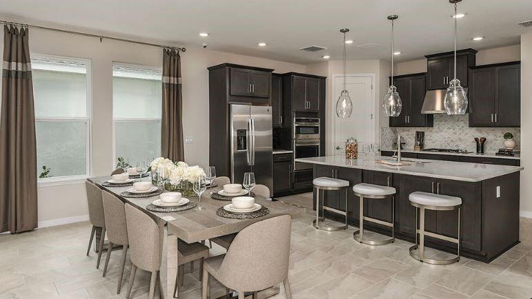 621 Se Ranch Palm City, FL 34990 - Photo 12 of 33 a kitchen with granite countertop a sink and white cabinets