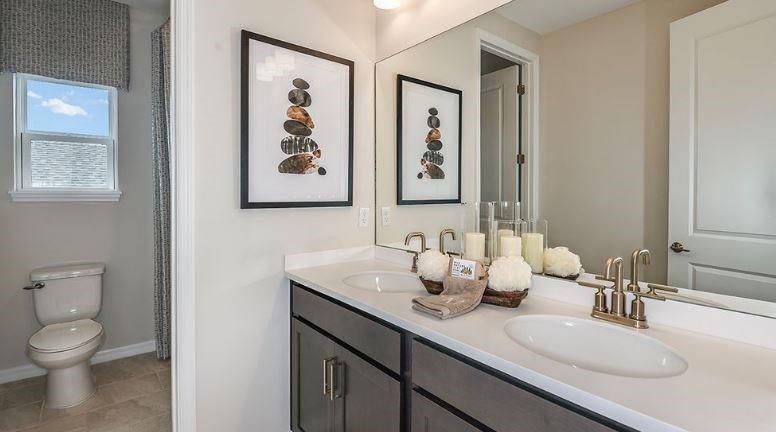 621 Se Ranch Palm City, FL 34990 - Photo 15 of 33 a bathroom with a toilet sink and mirror