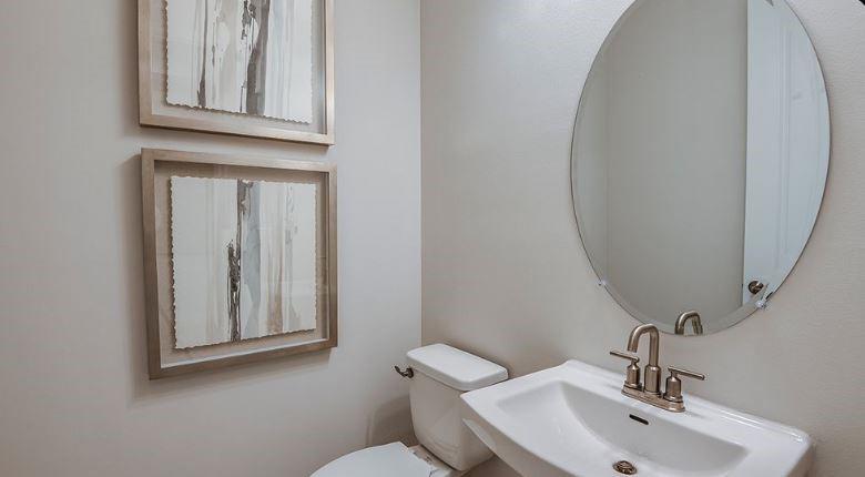 621 Se Ranch Palm City, FL 34990 - Photo 17 of 33 a bathroom with a toilet sink and mirror
